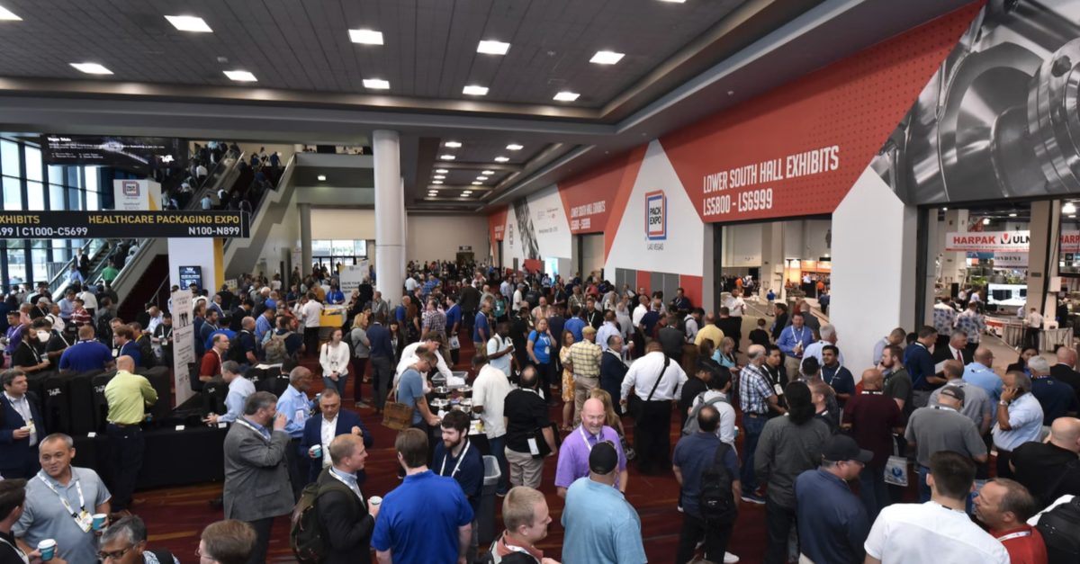 A vibrant, bustling trade show floor at PACK EXPO Las Vegas 2023.